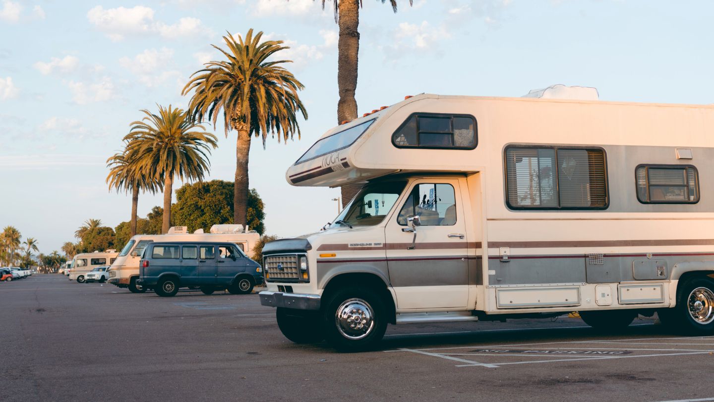 RV owner waiting with broken down motorhome in hot Phoenix sun