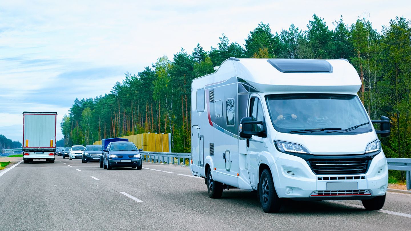 Lineup of different RV types: Class A, travel trailer, camper van